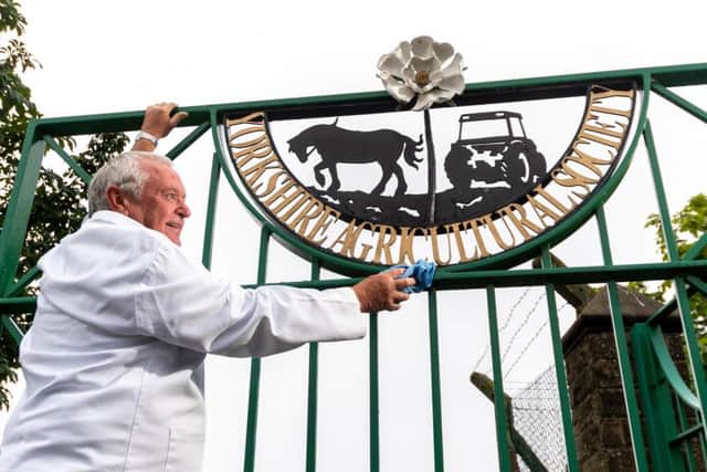 Gate attendant Brian Cooksey completes the final preparations ahead of this year's Great Yorkshire Show.