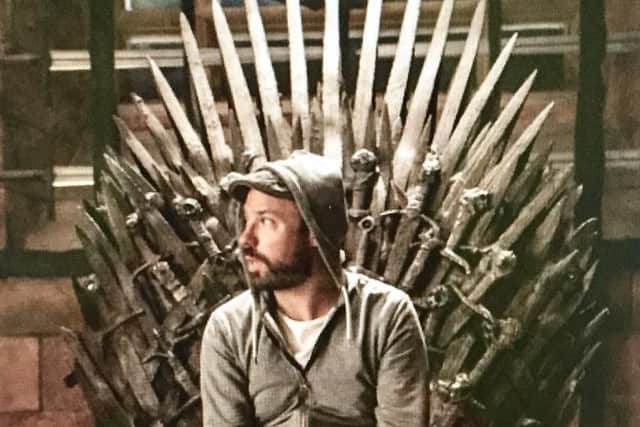 Wagner sitting on the show's famous Iron Throne.