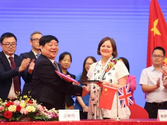 Sheffield Council leader Julie Dore signed a 60-year partnership deal with Wang Chunming, chairman and president of Chinese firm Sichuan Guodong Construction Group, in Sheffield's sister city Chengdu in 2016. Picture: Sheffield Council