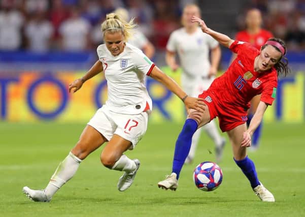 LYON, FRANCE - JULY 02: Rose Lavelle of the USA is challenged by Rachel Daly of England during the 2019 FIFA Women's World Cup France Semi Final match between England and USA at Stade de Lyon on July 02, 2019 in Lyon, France. (Photo by Richard Heathcote/Getty Images)