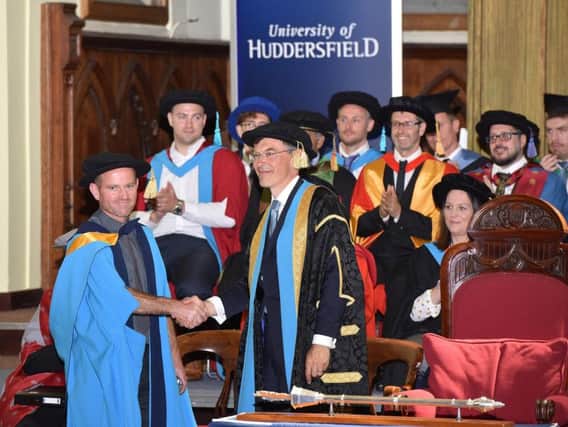 Jason Mallinson receiving his honorary doctorate from the University of Huddersfield
