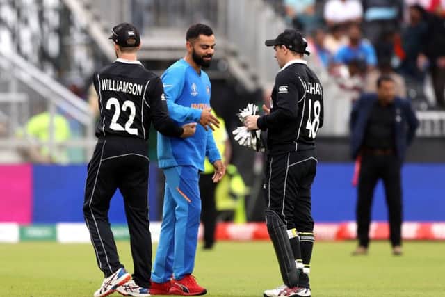 India's Virat Kohli (centre) shakes hands with New Zealand's Kane Williamson (left) and Tom Latham at Old Trafford. Picture: David Davies/PA