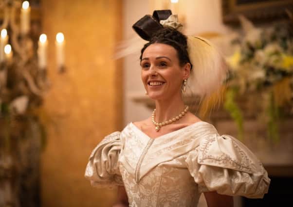 Suranne Jones as Anne Lister wears a white gown to the Queen of Denmark's birthday ball in the final episode of Gentleman Jack. Picture: BBC/Lookout Point/HBO/James Stack.