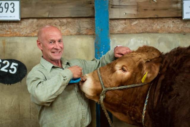 The farmer reunited with his prize-winning bull