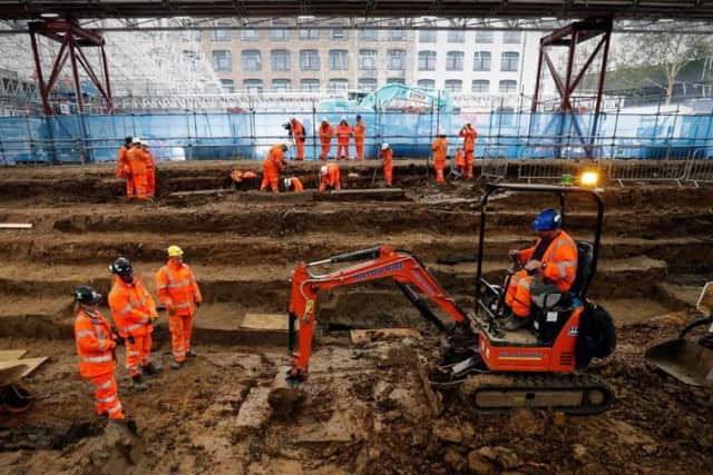 Field archaelogists excavate a late 18th to mid 19th century cemetery under St James Gardens near Euston train station in London on November 1, 2018 as part of the HS2 high-speed rail project.