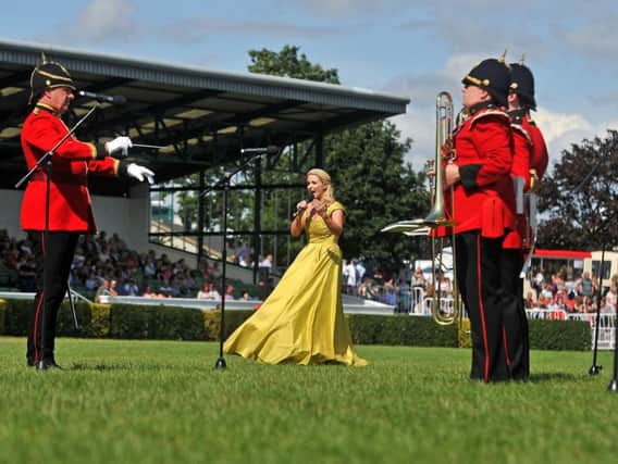 Soprano Lizzie Jones performs at the 161st Great Yorkshire Show in Harrogate with the band from the Yorkshire Regiment. Picture Tony Johnson.