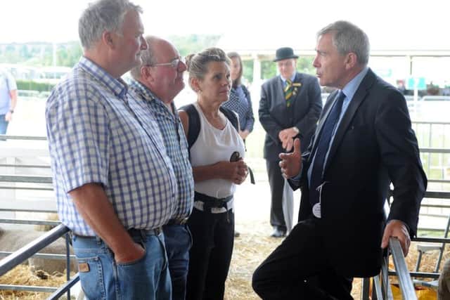 Farming Minister Robert Goodwill chats to Swaledale sheep farmers during his visit to the Great Yorkshire Show. Picture Tony Johnson.