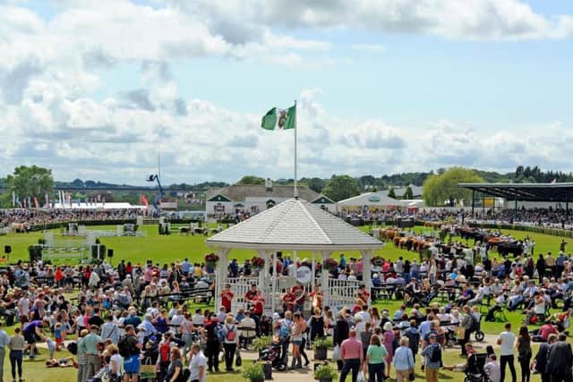 A view of the visitors on the President's Lawn, the bandstand and the cattle parade in the main ring at the 161st Great Yorkshire Show in Harrogate. Picture by Tony Johnson.