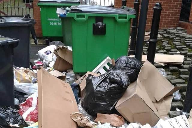 Opposition councillors claim that charges for disposing building materials have caused an increase in fly tipping.