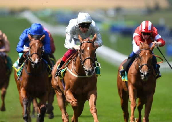 Raffle Prize ridden by jockey Frankie Dettori (centre) on his way to winning the Duchess of Cambridge Stakes during day two of the Moet and Chandon July Festival 2019 at Newmarket.