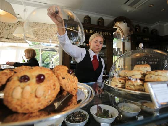 Following the life of a Fat Rascal from the bakery to Bettys Cafe Tea Rooms in Harrogate. Pictured is staff member Chrisie Deprez with a tray of Fat Rascal at the Cafe Tea Rooms. Picture: Chris Etchells