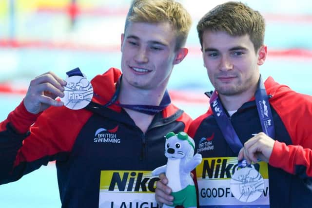 medals of honour: Jack Laugher and Dan Goodfellow with their silver medals. (Pictures: MANAN VATSYAYANA/AFP/Getty Images)