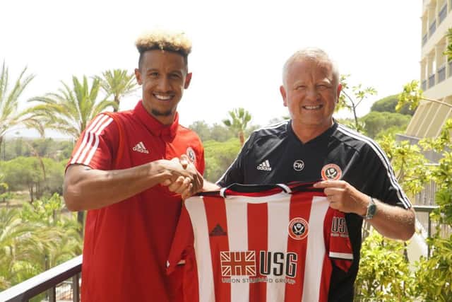 Welcome: New signing Callum Robinson is unveiled by Chris Wilder at Sheffield Uniteds training camp in Portugal. (Picture: SportImage)