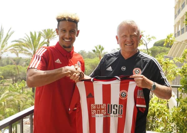 Welcome: New signing Callum Robinson is unveiled by Chris Wilder at Sheffield Uniteds training camp in Portugal. (Picture: SportImage)