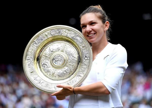 Simona Halep celebrates with the Wimbledon trophy (Picture: PA)