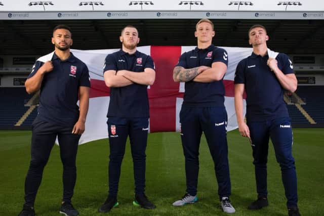 England Knights players Kruise Leeming, Cameron Smith, Mikolaj Oledzki and Jack Walker fly the English flag at Headingley.
