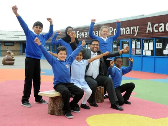 Feversham Primary Academy school council celebrate headteacher, Naveed Idrees, winning the Headteacher of the Year category in the 2019 TES School Awards