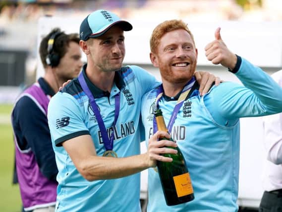 England's Chris Woakes (left) and Jonny Bairstow celebrate winning the ICC World Cup Final at Lord's, London. PRESS ASSOCIATION Photo. Picture date: Sunday July 14, 2019. See PA story CRICKET England. Photo credit should read: John Walton/PA Wire.
