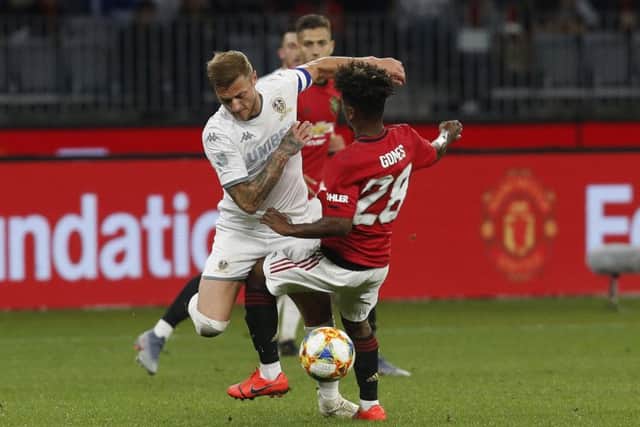 Leeds United Liam Cooper tackles the ball against Manchester United's Angel Gomes in Perth. Picture: Theron Kirkman/Sportimage