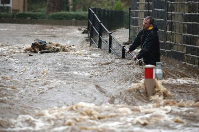 Residents battle against floodwater as the River Calder bursts its bank's in the Calder Valley town of Mytholmroyd.