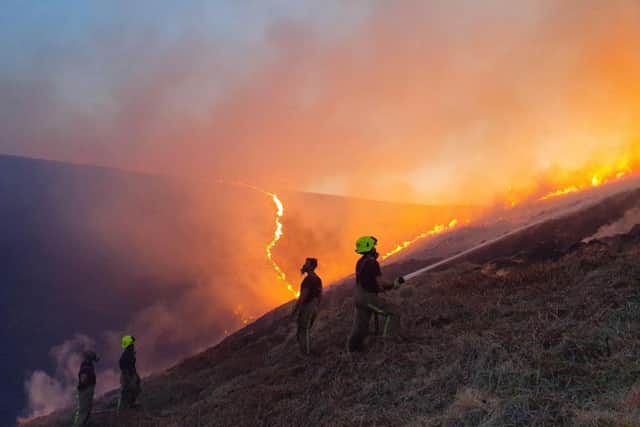 Firefighters tackling the moorland blaze earlier this year.