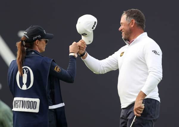 England's Lee Westwood celebrates with his girlfriend and caddie Helen Storey after his birdie on the 18th at Royal Portrush. Picture: David Davies/PA/TheOpen.com