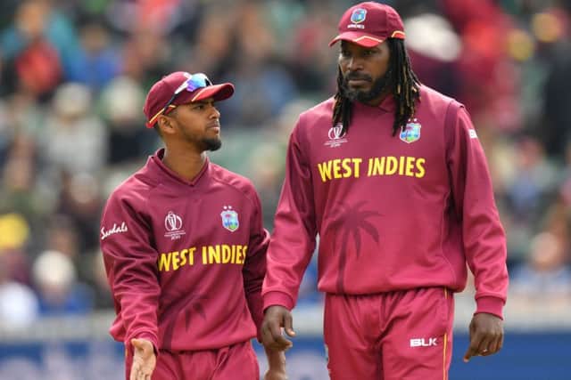 LEARNING PROCESS: West Indies' Nicholas Pooran, chats with experienced team-mate Chris Gayle during a World Cup game earlier this summer. Picture: Saeed Khan/Getty Images
