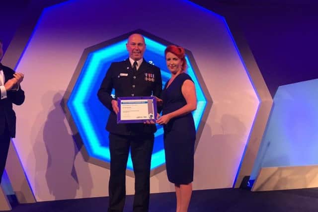 PC Ian Sweeney collecting his prestigious Police Bravery Award.