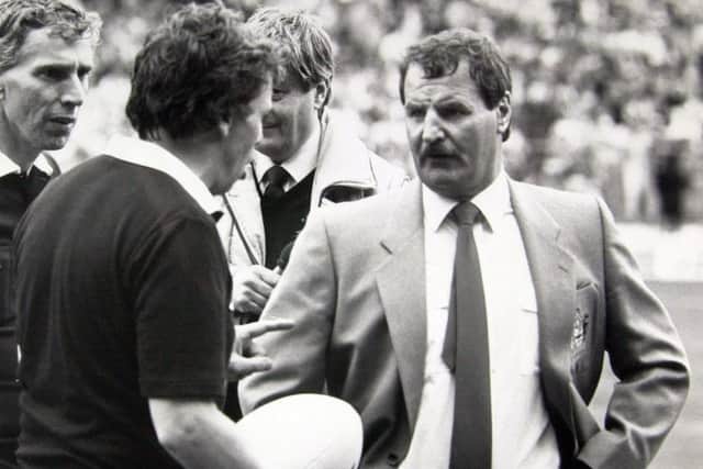 London : 3.5.87 -PA
Rugby league cup final.
St. Helens fiery coach Alex Murphy (right) has words with the referees of yesterdays Silk Cut Challenge Cup Rugby League final at Wembley, which his side lost to Halifax 19-18.
PA library copy.