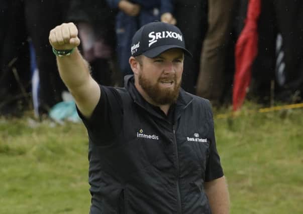 Ireland's Shane Lowry celebrates after his birdie at the 10th hole during the second round of the British Open Golf Championships at Royal Portrush today.