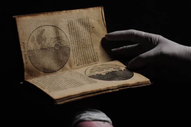 An original copy of Galileo Galileis 1610 book Starry Messenger is on display at the exhibition.