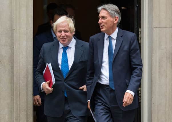 Chancellor Philip Hammond (right) will resign on Wednesday if, as expected, Boris Johnson, the former Foreign Secretary, becomes Prime Minister this week.
