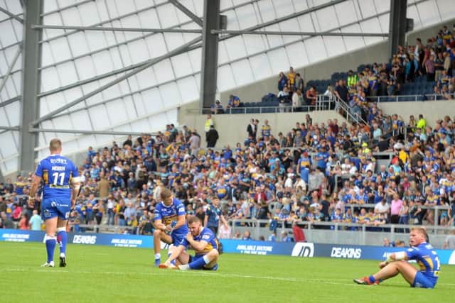 AND THE LOWS ... Leeds Rhinos' 
Rhinos players despondent at the final whistle at Headingley.  Picture: Tony Johnson.