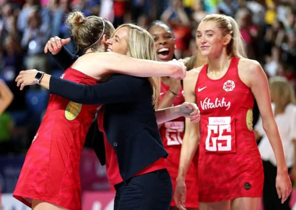 England coach Tracey Neville celebrates with Joanne Harten (left) after their match against South Africa.