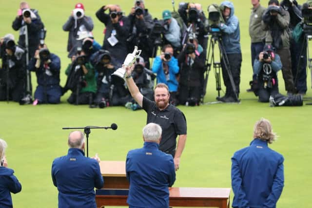 CENTRE OF ATTENTION: Shane Lowry celebrates winning the Claret Jug during day four of The Open Championship 2019 at Royal Portrush. Picture: Niall Carson/PA