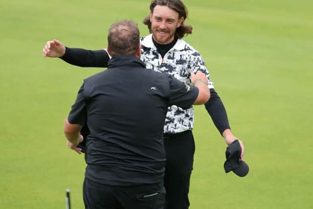 Runner-up Tommy Fleetwood congratulates Shane Lowry for winning The Open at Royal Portrush. Picture: Richard Sellers/PA