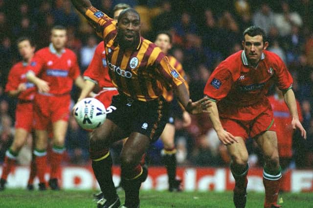 Darren Moore, seen in action for Bradford City, following his move from Doncaster in the 90s.