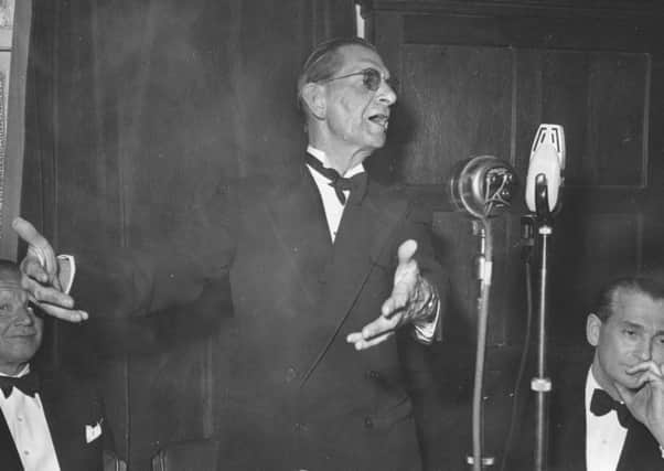 Neville Cardus making a speech in 1950. (Getty Images).
