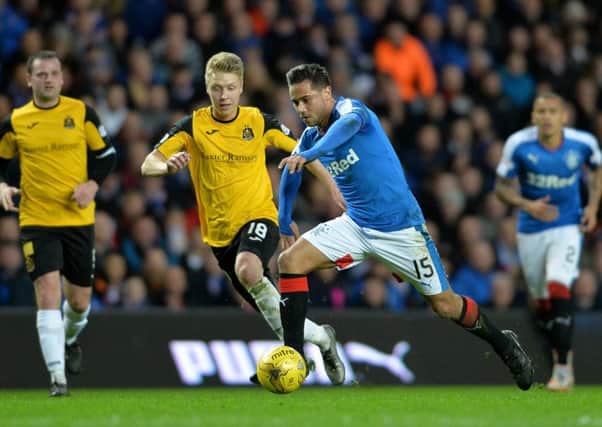 NEW FACE: Jamie Lindsay, left, in action for Dumbarton against Rangers. Picture: Mark Runnacles/Getty Images