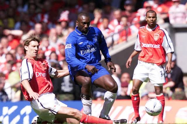 Chelsea's Jimmy Floyd Hasselbaink (centre) is tackled by Arsenal captain Tony Adams during the 2002 FA Cup Final at the Millennium Stadium.  Picture: PA/David Davies