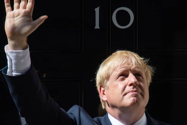 Boris johnson on the steps of 10 Downing Street.