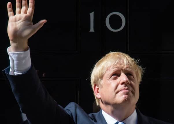 Boris Johnson enters 10 Downing Street for the first time as Prime Minister.