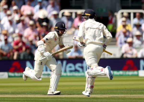England's Jack Leach (left) and Jason Roy (right) run during day two at Lord's. Picture: Bradley Collyer/PA