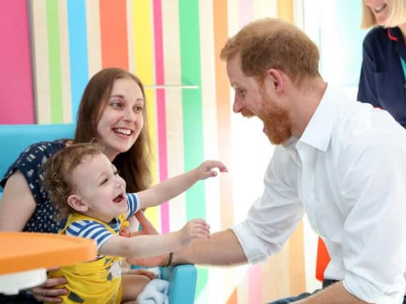 The Duke of Sussex plays with one year old Noah Nicholson during his visit to Sheffield Children's Hospital in Clarkson Street, Sheffield. PA.
