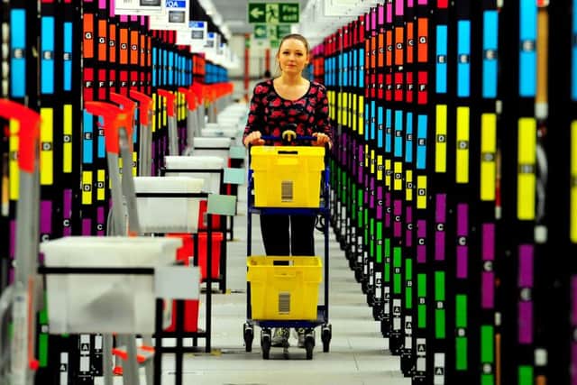 Library image of a worker at an Amazon  centre in the UK. Photo: Nick Ansell/PA Wire