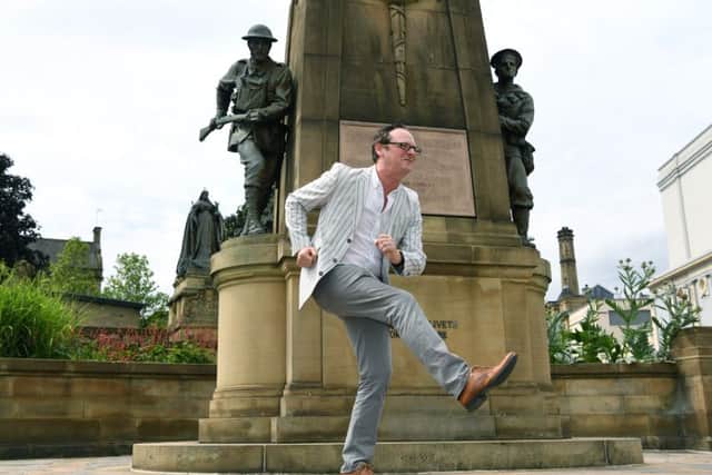 David Wilson, director of Bradford City of Film, in front of the war memorial where Billy Liar was shot in 1963. Picture: Jonathan Gawthorpe
