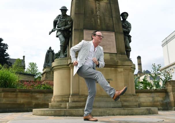 David Wilson, director of Bradford City of Film, in front of the war memorial where Billy Liar was shot in 1963. Picture: Jonathan Gawthorpe