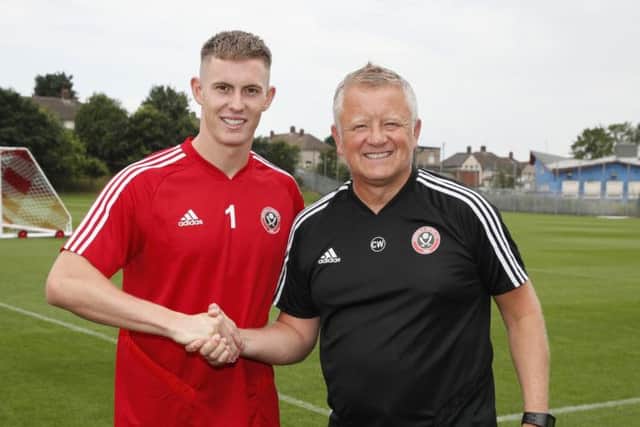 Returning Dean Henderson is welcomed back by Sheffield United manager Chris Wilder at Shirecliffe Training Centre, Sheffield on Friday (Picture: Simon Bellis/Sportimage).