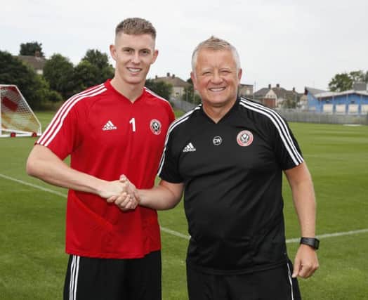 Returning Dean Henderson is welcomed back by Sheffield United manager Chris Wilder at Shirecliffe Training Centre, Sheffield on Friday (Picture: Simon Bellis/Sportimage).