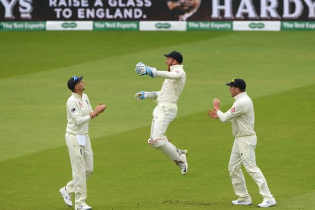 ON YOUR WAY: Jonny Bairstow celebrates with Joe Root and Jason Roy after catching William Porterfield during day three at Lord's. Picture: Stu Forster/Getty Images